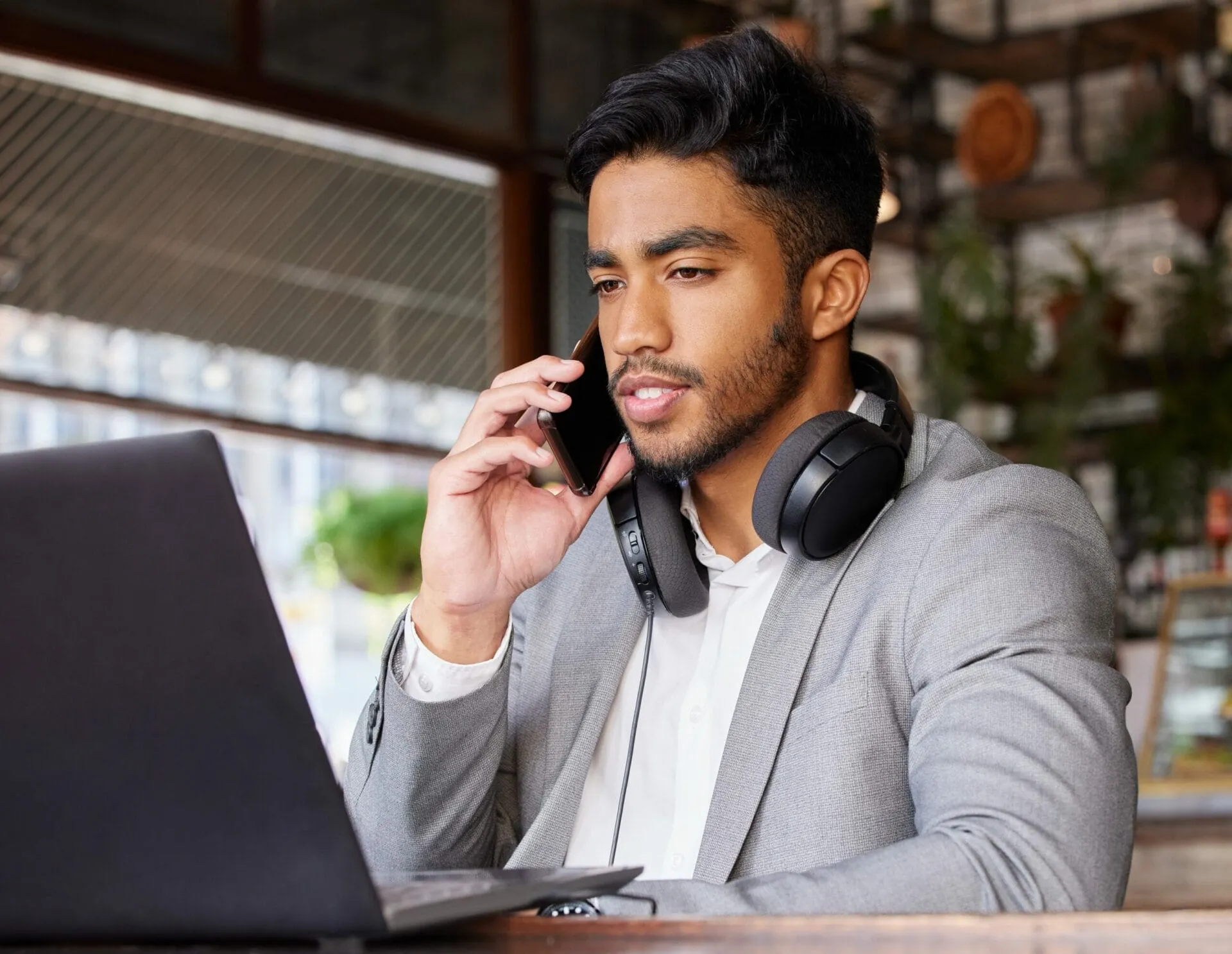young-businessman-using-laptop-on-business-call-unified-voice