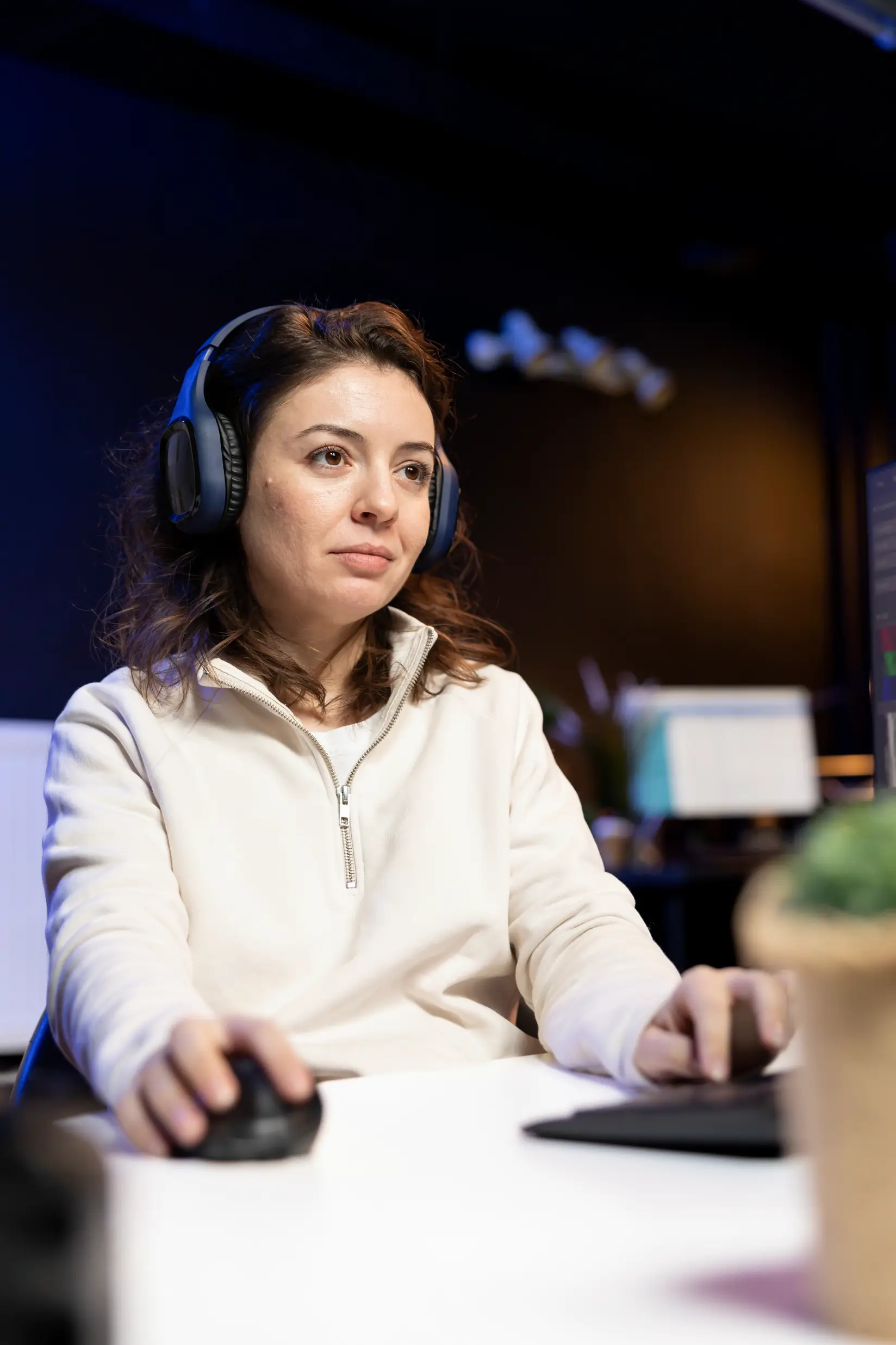 photo-editor-editing-images-wearing-headphones-office-unified-voice