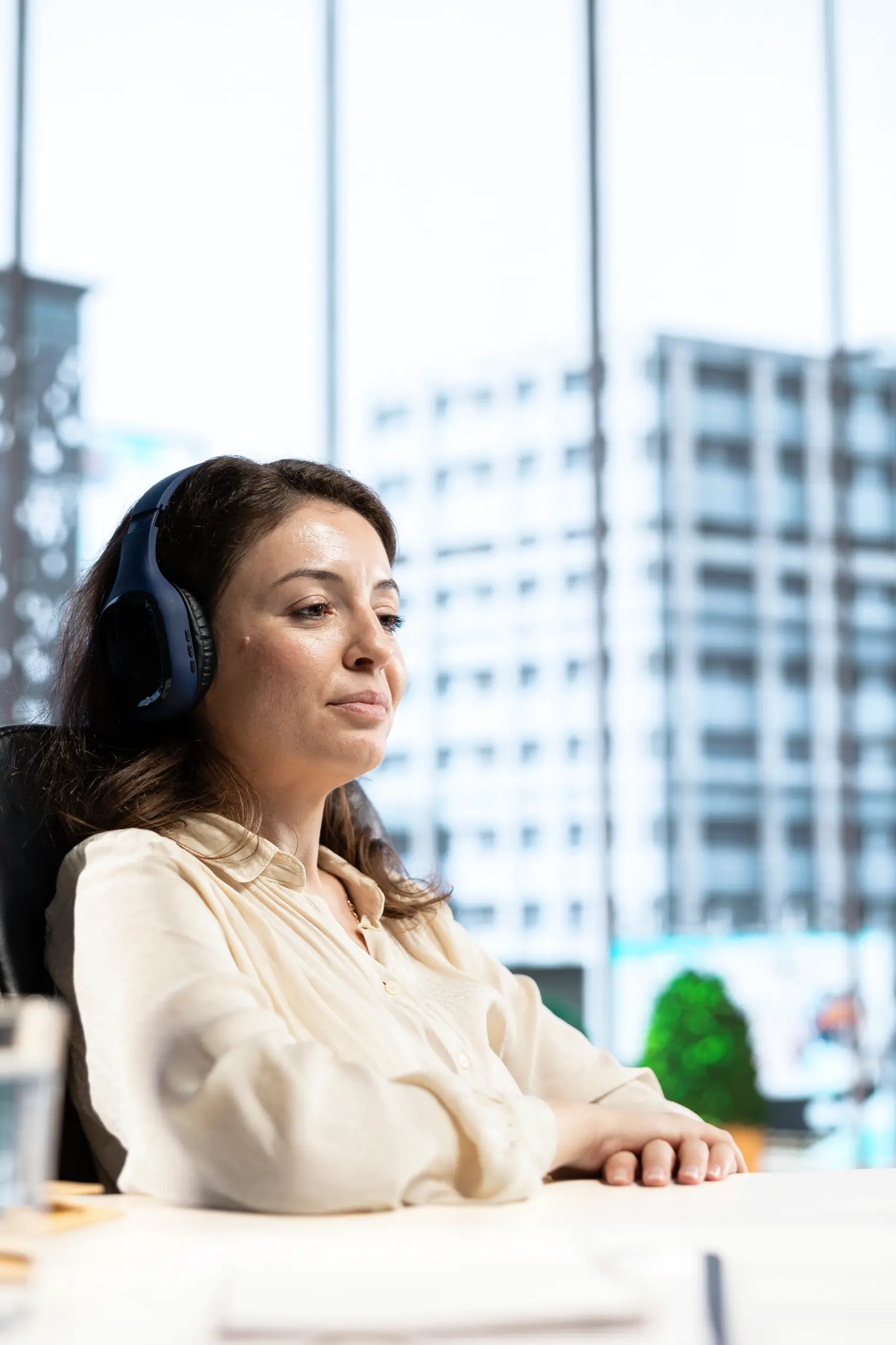 joyful-female-ceo-working-listening-podcast-unified-voice