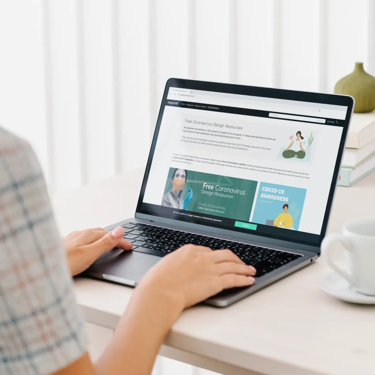 woman-checking-free-design-resources-website-unified-voice